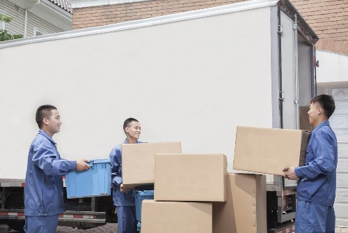 Local house removals service in Edgware with moving van and packed boxes