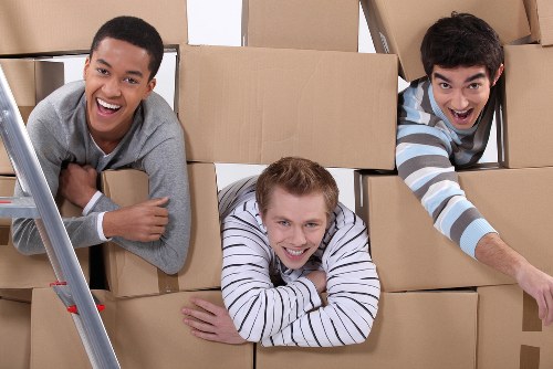 Packed household boxes ready for loading in an Edgware property