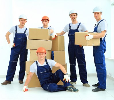 Packed boxes and furniture prepared for urgent removals in Edgware