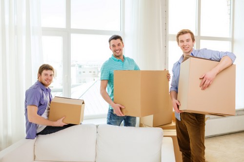 Careful loading of household items for a move in Edgware
